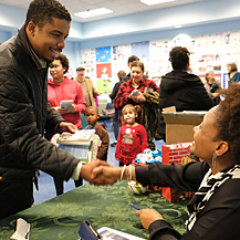 Tracy K. Smith chats with and signs copies of "American Journal" for audience members at the South Lafourche Public Library in Cut Off, LA. December 15, 2018. Credit: Kevin Rabalais.